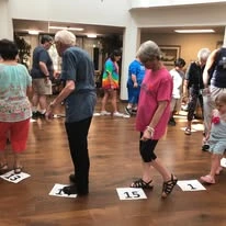 Colonial Harbor Gracious Retirement Living Hawthorn Senior Independent Living in Yorktown, Virginia residents playing a game