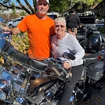 American House Stone senior living community offering independent living and respite care in Rochester Hills, MI, smiling resident as she sits on a motorcycle