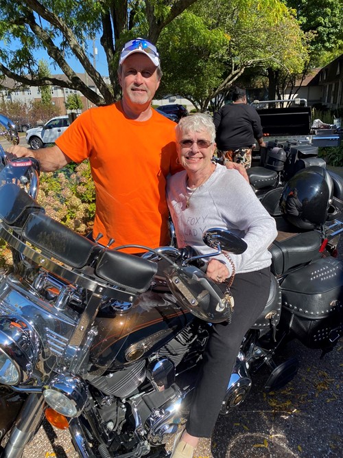American House Stone Independent Senior Living in Rochester Hills, MI resident sitting on a motorcycle
