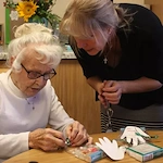 Grace Point Place Assisted Senior Living Memory Care in Oak Lawn, IL resident doing a craft