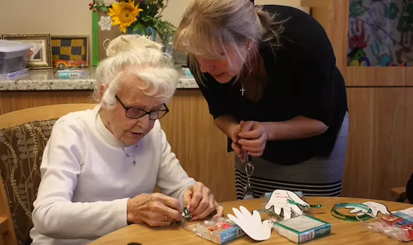 Grace Point Place Assisted Senior Living Memory Care in Oak Lawn, IL resident doing a craft