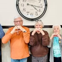 Sequoia Grove Gracious Retirement Living Hawthorn Senior Independent Living in Granite Bay, California residents holding up a heart