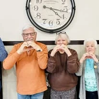 Sequoia Grove Gracious Retirement Living Hawthorn Senior Independent Living in Granite Bay, California residents holding up a heart
