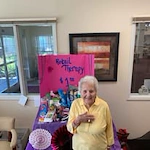 Providence Meadows Gracious Retirement Living Hawthorn Senior Independent Living in Charlotte, North Carolina resident holding a retail therapy shop