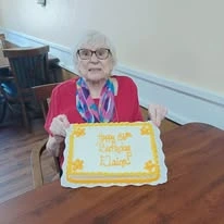Ascension Living Via Christi Village Ponca City Senior Living in Ponca City, Oklahoma resident with birthday cake