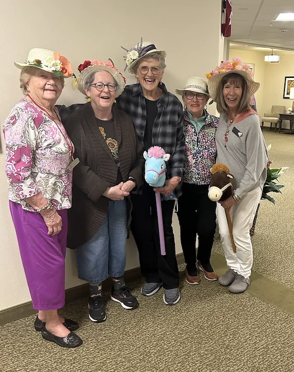 Camellia Gardens Gracious Retirement Living Hawthorn Senior Independent Living in Maynard, Massachusetts residents wearing fun hats