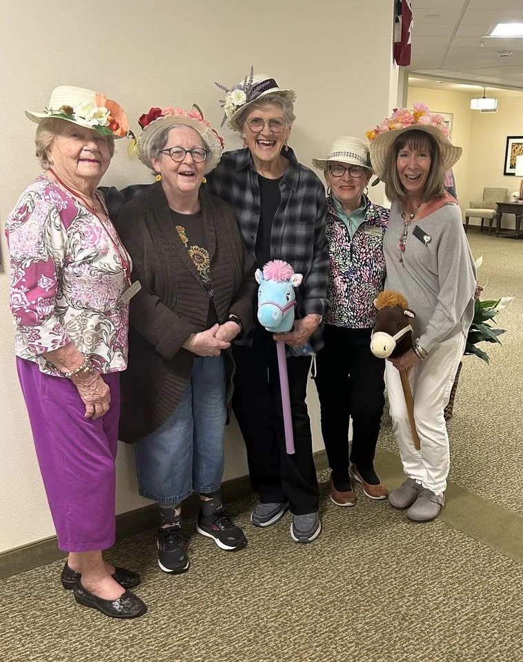 Camellia Gardens Gracious Retirement Living Hawthorn Senior Independent Living in Maynard, Massachusetts residents wearing fun hats