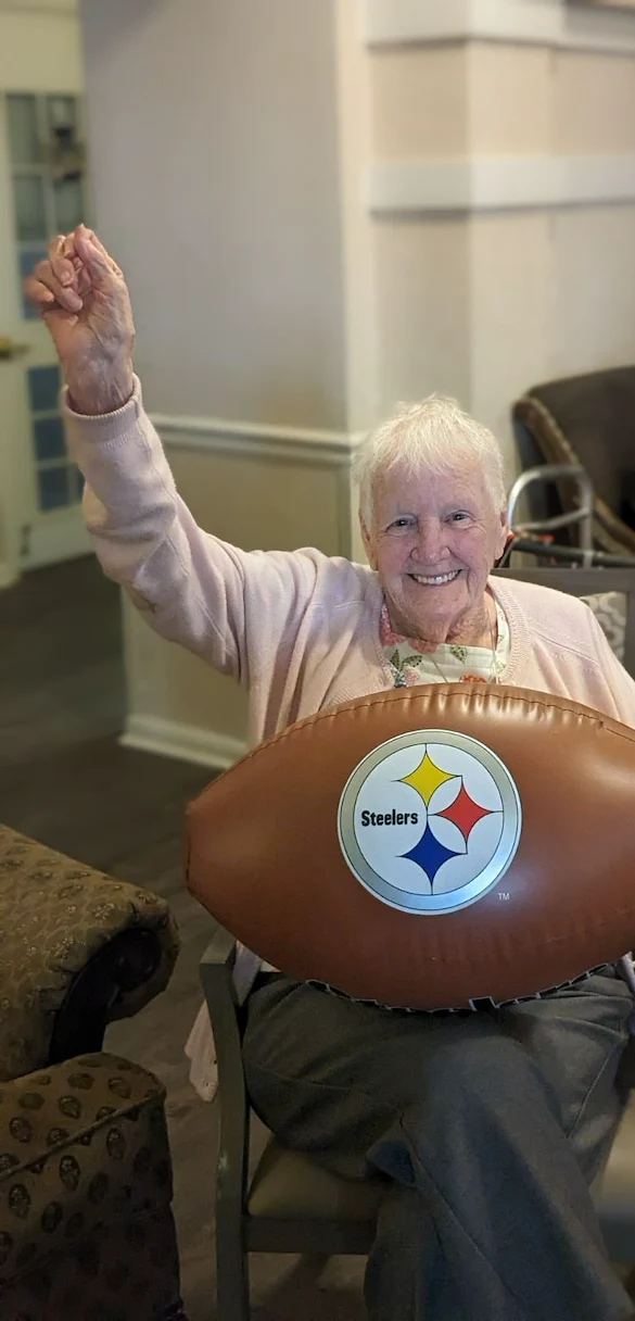 Hawthorne Woods by New Perspective in Washington, PA, happy resident ready to cheer during a football game