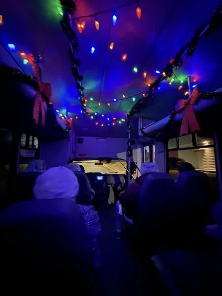 Gaines Park residents taking a bus to go to a Christmas light viewing