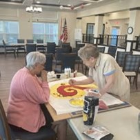 The Savoy Gracious Retirement Living Hawthorn Senior Independent Living in Winter Springs, Florida residents doing arts and crafts