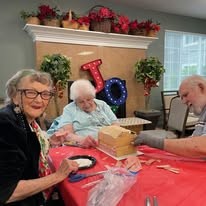Bella Vista Gracious Retirement Living Hawthorn Senior Independent Living in Asheville, North Carolina residents making a festive gingerbread house