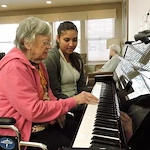 Willowbrook Place Senior Assisted Living Memory Care in Littleton, CO resident playing piano