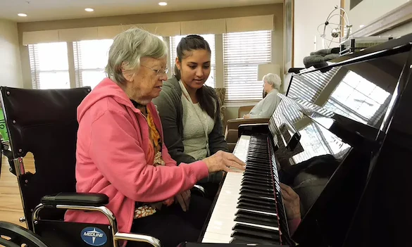 Willowbrook Place Senior Assisted Living Memory Care in Littleton, CO resident playing piano