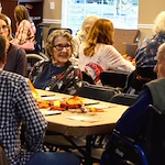 Residents of Gaines Park enjoying a Thanksgiving celebration