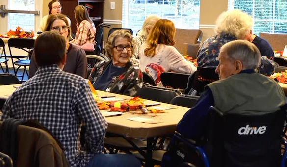 Residents of Gaines Park enjoying a Thanksgiving celebration