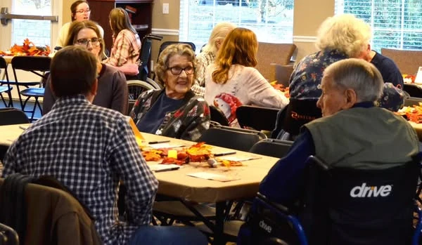 Residents of Gaines Park enjoying a Thanksgiving celebration