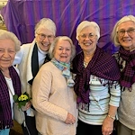 Covenant Living at The Holmstad in Batavia, IL, smiling residents during a celebration
