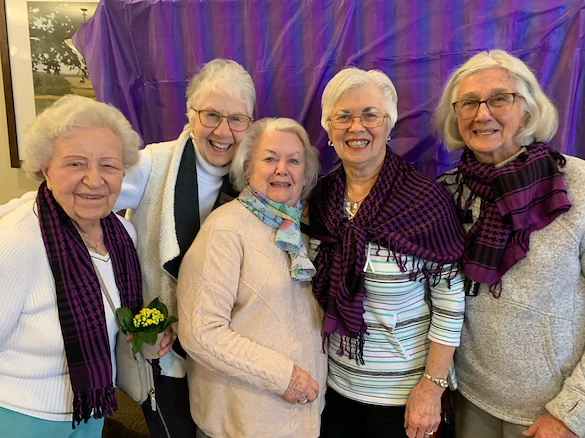 Covenant Living at The Holmstad in Batavia, IL, smiling residents during a celebration