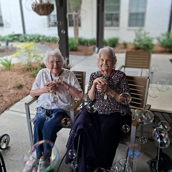 The Blake at Carnes Crossroads residents enjoying bubbles and Bahama Mamas