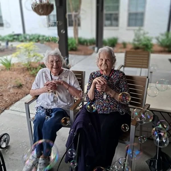 The Blake at Carnes Crossroads residents enjoying bubbles and Bahama Mamas