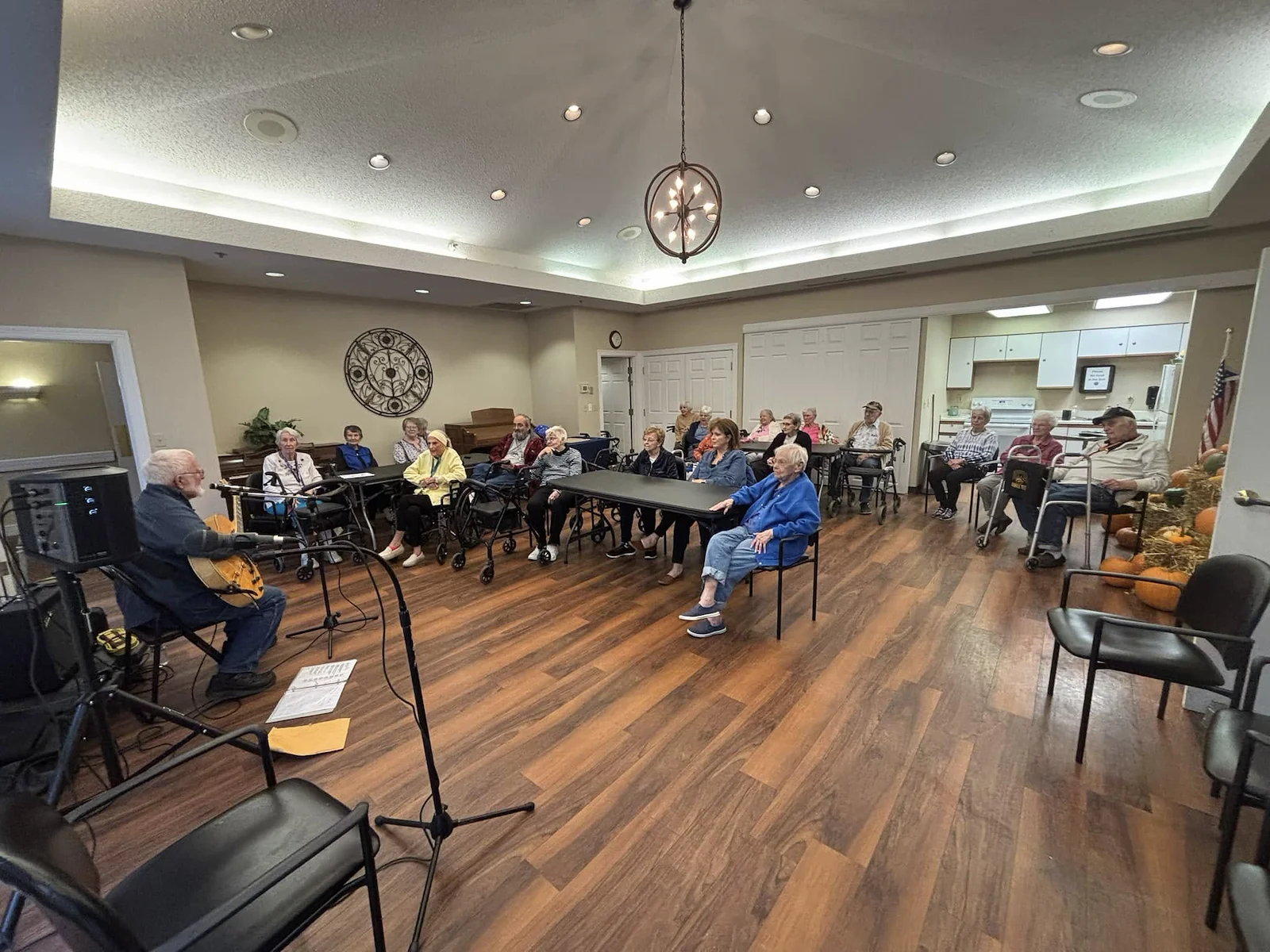 Seniors listening to guitar player