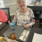 Charter Senior Living of Franklin in Franklin, Tennessee, happy resident enjoying a social hour