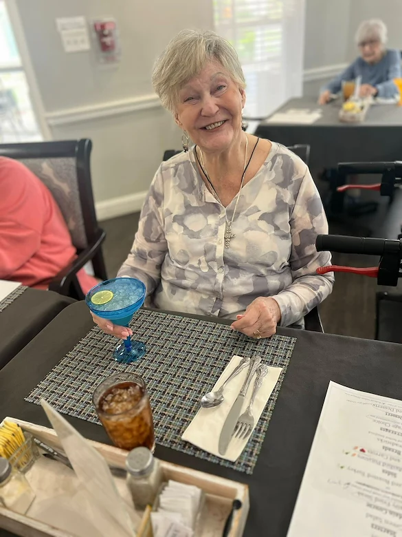 Charter Senior Living of Franklin in Franklin, Tennessee, happy resident enjoying a social hour