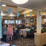 Wenatchee Senior Living by Cogir senior living community offering independent living, assisted living, and respite care in Wenatchee, WA, residents gathered together for a celebration