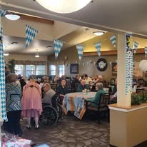 Wenatchee Senior Living by Cogir senior living community offering independent living, assisted living, and respite care in Wenatchee, WA, residents gathered together for a celebration