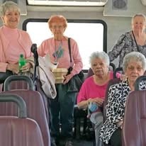 Cottonwood Estates Gracious Retirement Living Hawthorn Senior Independent Living in Alpharetta, Georgia residents on a transportation bus