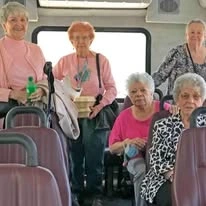 Cottonwood Estates Gracious Retirement Living Hawthorn Senior Independent Living in Alpharetta, Georgia residents on a transportation bus