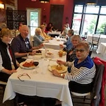 Kennedy Meadows Gracious Retirement Living Hawthorn Senior Independent Living in North Billerica, Massachusetts residents eating at a restaurant