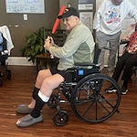 One of Orchard Ridge's residents enjoying a fun afternoon game of indoor baseball