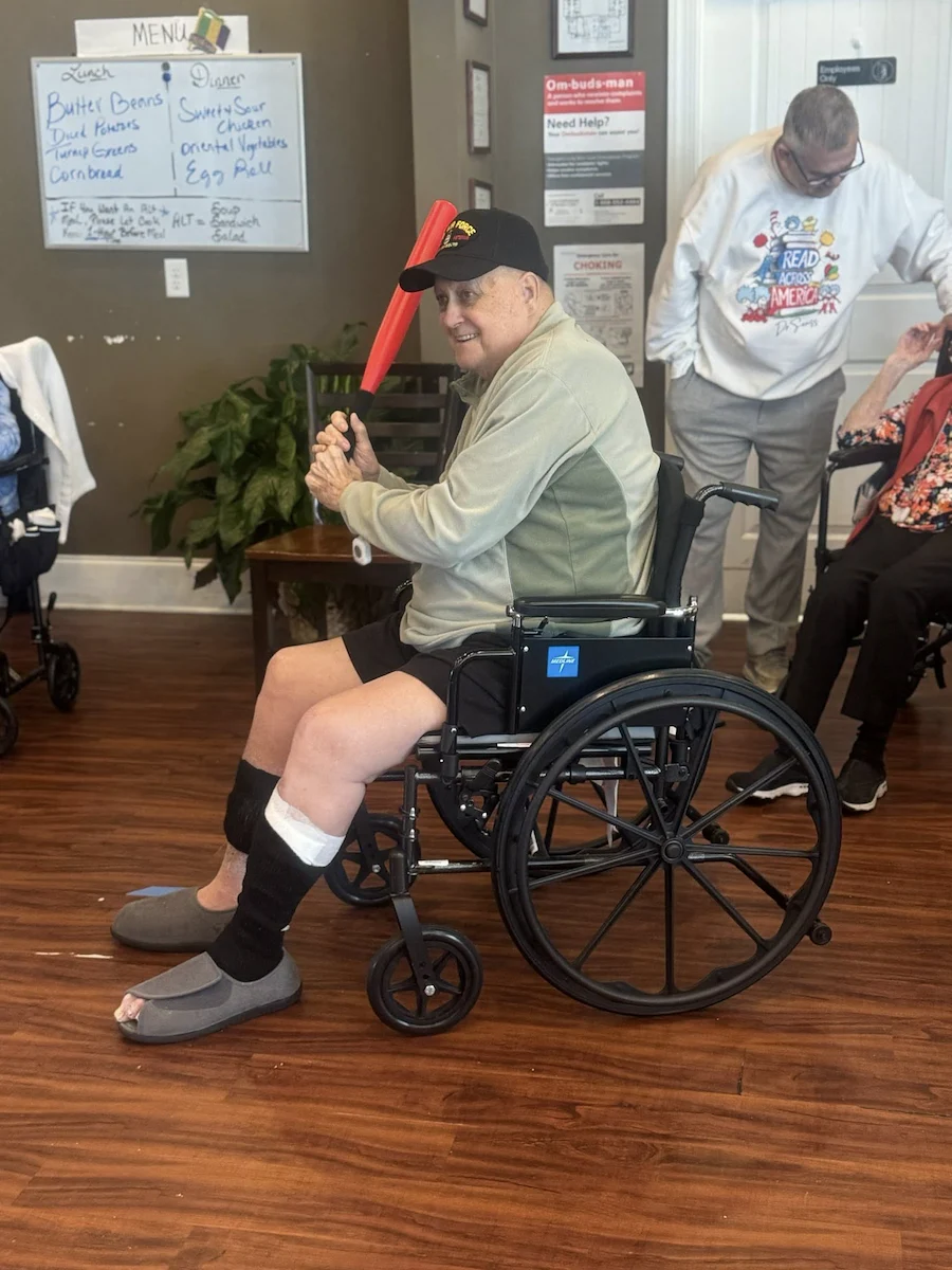 One of Orchard Ridge's residents enjoying a fun afternoon game of indoor baseball