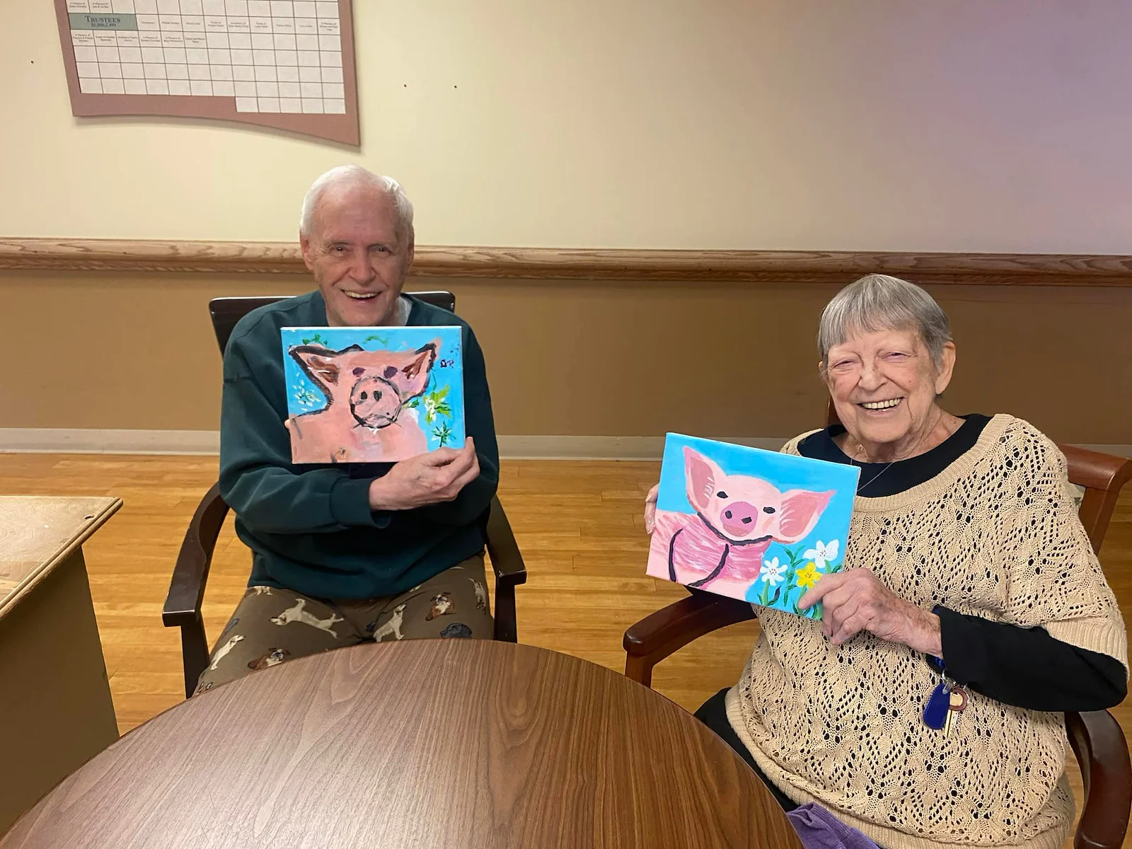 Prime Healthcare Senior Living – Fox Knoll Village in Aurora, IL, residents smile with their artwork
