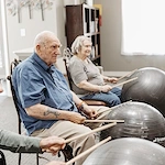 Residents participating in drumming activity