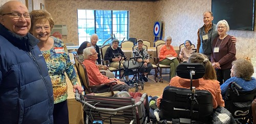 American House Stone Independent Senior Living in Rochester Hills, MI residents sitting in a circle and socializing