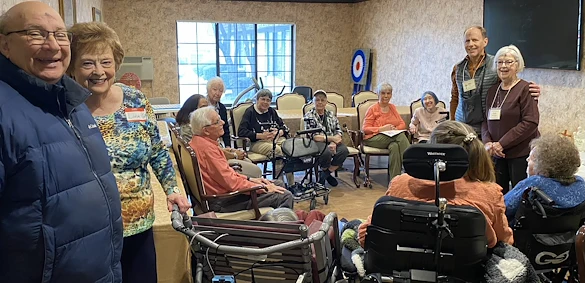 American House Stone senior living community offering independent living and respite care in Rochester Hills, MI, residents sitting in a circle and socializing