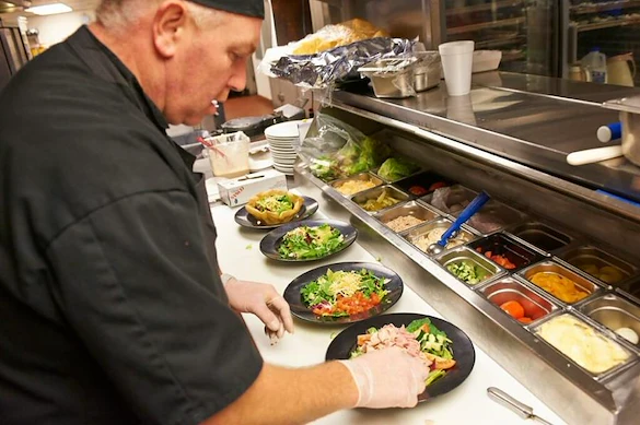 John Knox Village Senior Living CCRC near Kansas City, MO chef preparing food
