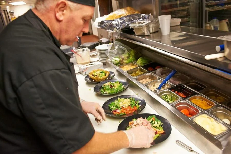 John Knox Village Senior Living CCRC near Kansas City, MO chef preparing food