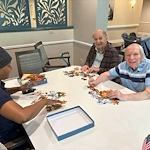 Charter Senior Living of Dedham in Dedham, MA, stimulating activity for residents - puzzles