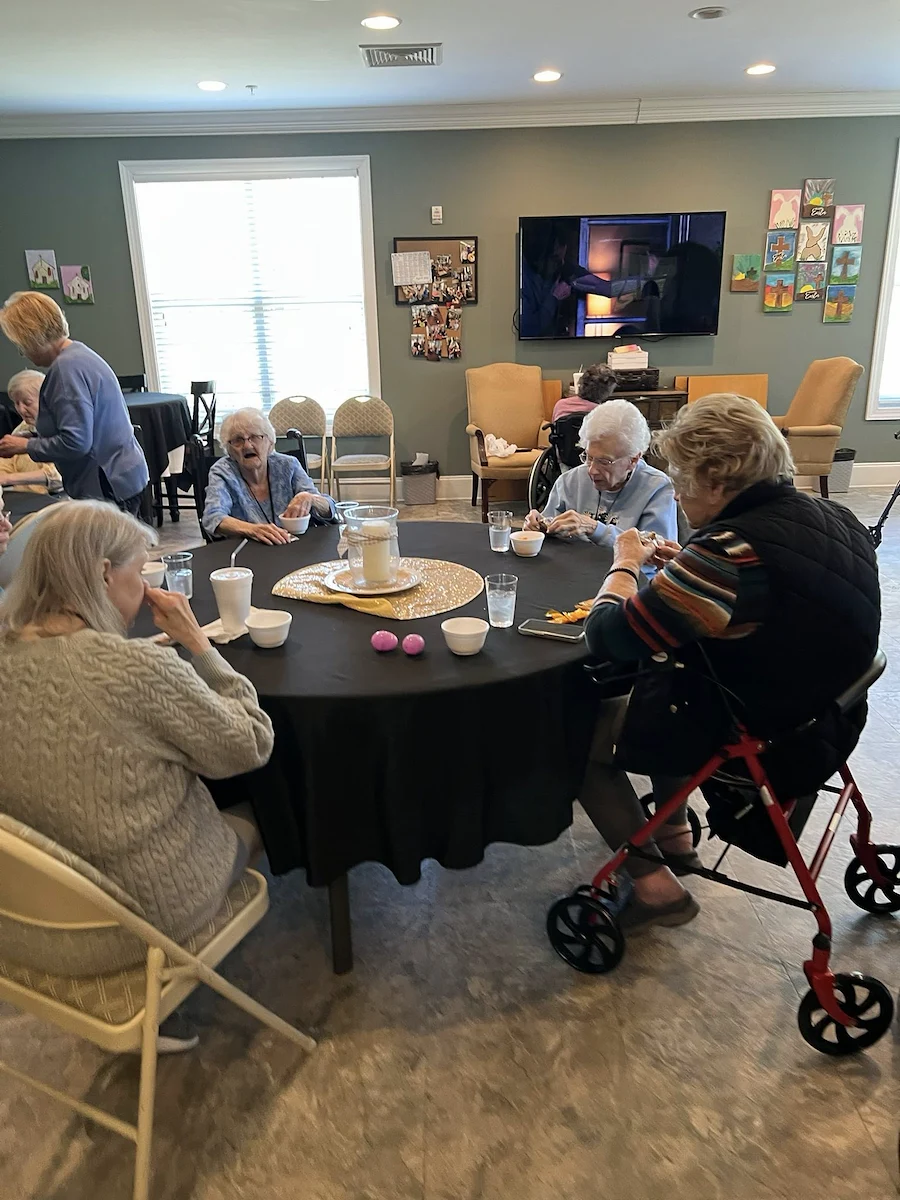 Orchard Ridge residents stuffing easter eggs and making decorative baskets to go along with it