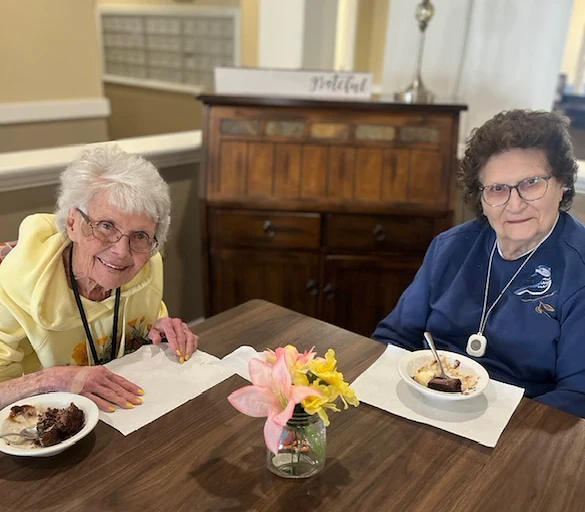 Pathfinder Senior Living in Fremont, NE, smiling residents enjoying a sweet treat