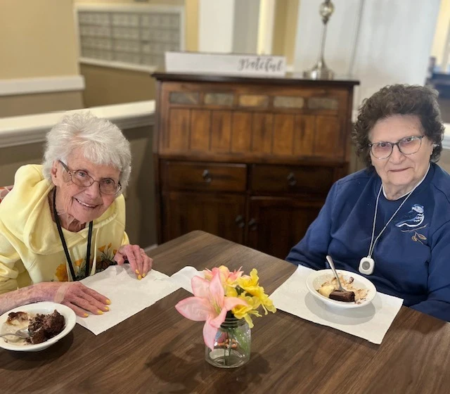 Pathfinder Senior Living in Fremont, NE, smiling residents enjoying a sweet treat