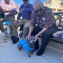 Paloma Landing Retirement Community Hawthorn Senior Independent Living in Albuquerque, New Mexico residents petting puppies