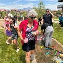 water balloon fight at Ovation Sienna Hills Senior Living in Washington, Utah