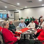 Astral at Auburn, senior living community offering independent living, assisted living, and memory care in Auburn, IN, residents enjoying a holiday celebration