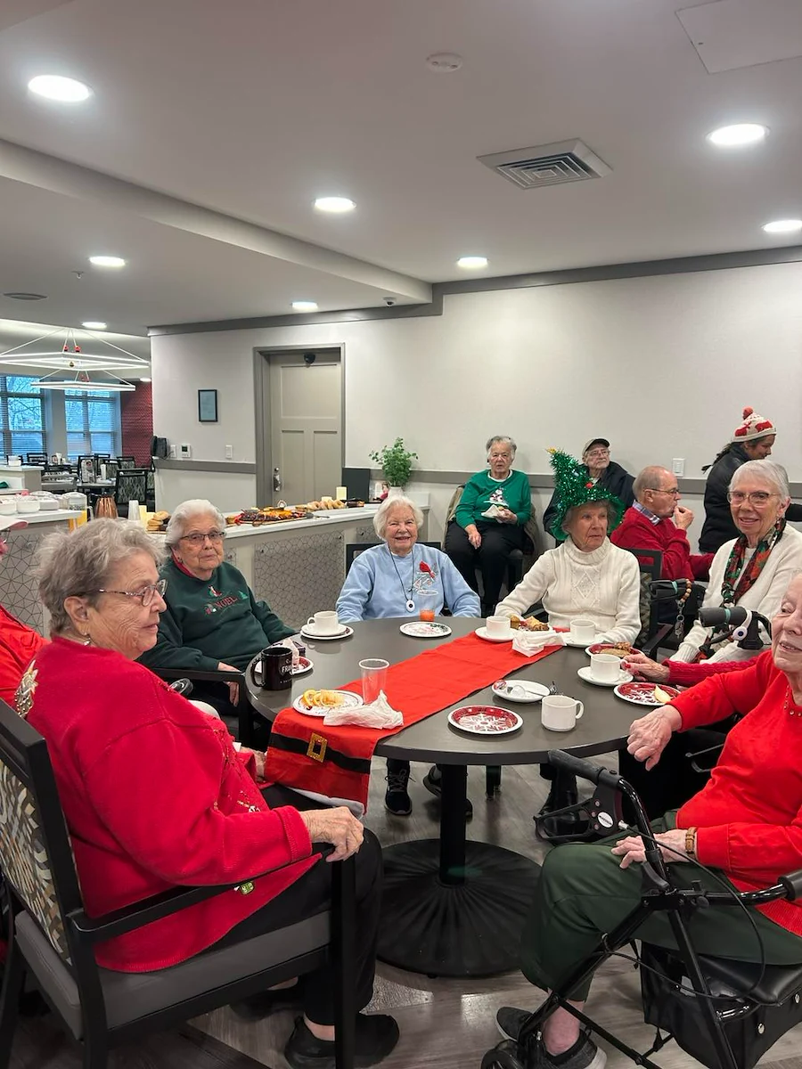 Astral at Auburn, senior living community offering independent living, assisted living, and memory care in Auburn, IN, residents enjoying a holiday celebration