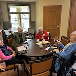 Residents of the Waters of Plymouth enjoying a Trader Joe's red wine tasting
