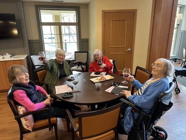 Residents of the Waters of Plymouth enjoying a Trader Joe's red wine tasting
